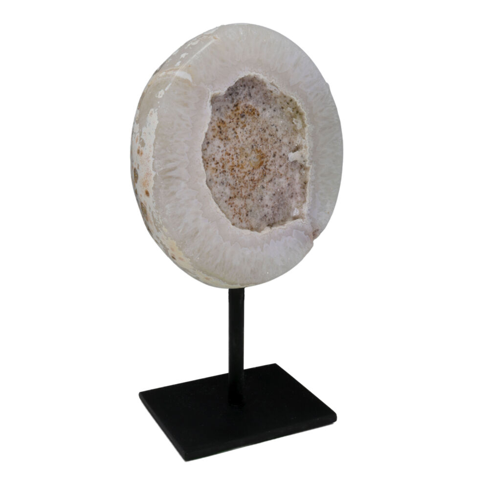 This Agate Geode has a large druze pocket in the center. Druze is a formation of tiny crystals on the surface, or in the center of a larger crystal. This Agate is speckled with druze. The Agate band that surrounds the druze pocket is a light beige color and has a light exterior. Both sides are high polished to give it appeal from every angle. This stunning piece is displayed on a black metal post with a rectangle shaped base. Agate Geodes are powerful crystals for good luck, protection and spiritual growth. Speckled Druze Geode On Post Stand with Polished Back