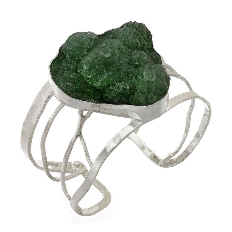 Natural green fluorite cuff set in .925 sterling silver. Simple and stunning natural green fluorite creates a visual and textural sensation with this one of a kind matching cuff. Incredible hand selected green fluorite offers a splash of color and is designed to harmonize your vibration and enhance your life. Pairs well with our natural fluorite necklace Natural Green Fluorite Cuff