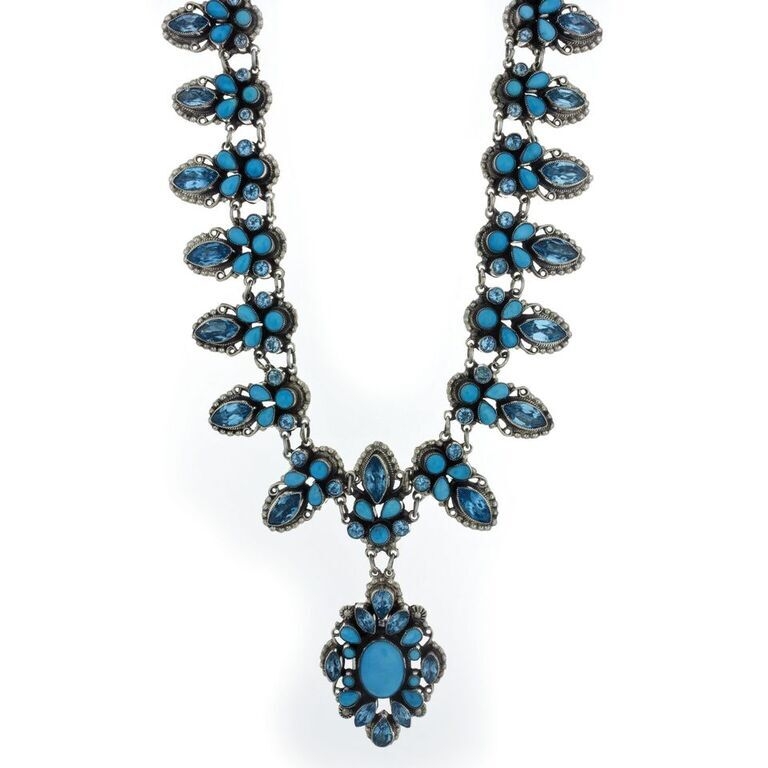 This elegant Sleeping Beauty Turquoise Necklace has gorgeous cabochons of Sleeping Beauty Turqouise and faceted gems of Blue Topaz. The Sleeping Beauty Mine in Globe, AZ is some of the most sought after Turquoise in the world. The mine has since closed making it's Turquoise far more valuable. Add this one of a kind masterpiece to your collection today and own a piece of Turquoise history! Leo Feeney Necklace With Sleeping Beauty Turquoise And Blue Topaz