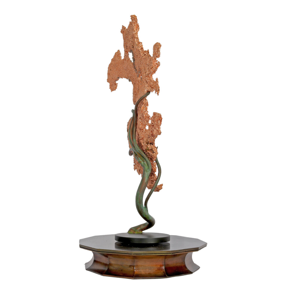 <span style="position: initial; margin: initial;"></span><span style="font-family: "EB Garamond"; position: initial; margin: initial;">Michigan Native Copper Specimen On Custom Rotating Vine Stand -Flat.</span><div style="position: initial; margin: initial;"><div style="font-size: 16.8px; position: initial; margin: initial;"><p style="margin: initial; line-height: normal; color: rgb(0, 0, 0); font-variant-numeric: normal; font-variant-east-asian: normal; font-stretch: normal; font-family: "EB Garamond"; position: initial;"><span style="position: initial; margin: initial;"><font style="font-size: 1.2rem; line-height: 22px; position: initial; margin: initial;">Native Copper </font></span><span style="font-size: 1.2rem; position: initial; margin: initial;">is used to form these interesting sculptures. Molten copper at</span></p><p style="margin: initial; line-height: normal; color: rgb(0, 0, 0); font-variant-numeric: normal; font-variant-east-asian: normal; font-stretch: normal; font-family: "EB Garamond"; position: initial;"><font style="font-size: 1.2rem; line-height: 22px; position: initial; margin: initial;">2200 degrees Fahrenheit is poured into a water-soaked straw. The straw forms</font></p><p style="margin: initial; line-height: normal; color: rgb(0, 0, 0); font-variant-numeric: normal; font-variant-east-asian: normal; font-stretch: normal; font-family: "EB Garamond"; position: initial;"><font style="font-size: 1.2rem; line-height: 22px; position: initial; margin: initial;">the shape then burns away, and the copper forms solidify in the cool water.</font></p><p style="margin: initial; line-height: normal; color: rgb(0, 0, 0); font-variant-numeric: normal; font-variant-east-asian: normal; font-stretch: normal; font-family: "EB Garamond"; position: initial;"><font style="font-size: 1.2rem; line-height: 22px; position: initial; margin: initial;">Old customs of the early miners indicate that lead was used in the above</font></p><p style="margin: initial; line-height: normal; color: rgb(0, 0, 0); font-variant-numeric: normal; font-variant-east-asian: normal; font-stretch: normal; font-family: "EB Garamond"; position: initial;"><font style="font-size: 1.2rem; line-height: 22px; position: initial; margin: initial;">process. Fortune telling was a New Year’s Day pastime; good or bad luck was</font></p><p style="margin: initial; line-height: normal; color: rgb(0, 0, 0); font-variant-numeric: normal; font-variant-east-asian: normal; font-stretch: normal; font-family: "EB Garamond"; position: initial;"><font style="font-size: 1.2rem; line-height: 22px; position: initial; margin: initial;">determined by the shape and size of the sculpture. Following the old</font></p><p style="margin: initial; line-height: normal; color: rgb(0, 0, 0); font-variant-numeric: normal; font-variant-east-asian: normal; font-stretch: normal; font-family: "EB Garamond"; position: initial;"><font style="font-size: 1.2rem; line-height: 22px; position: initial; margin: initial;">traditions, this sculptured copper has been proudly manufactured in</font></p><p style="margin: initial; line-height: normal; color: rgb(0, 0, 0); font-variant-numeric: normal; font-variant-east-asian: normal; font-stretch: normal; font-family: "EB Garamond"; position: initial;"><font style="font-size: 1.2rem; line-height: 22px; position: initial; margin: initial;">Michigan’s Keweenaw Peninsula. An amazing work of art.</font></p></div></div> Michigan Native Copper Specimen On Custom Rotating Vine Stand -Flat