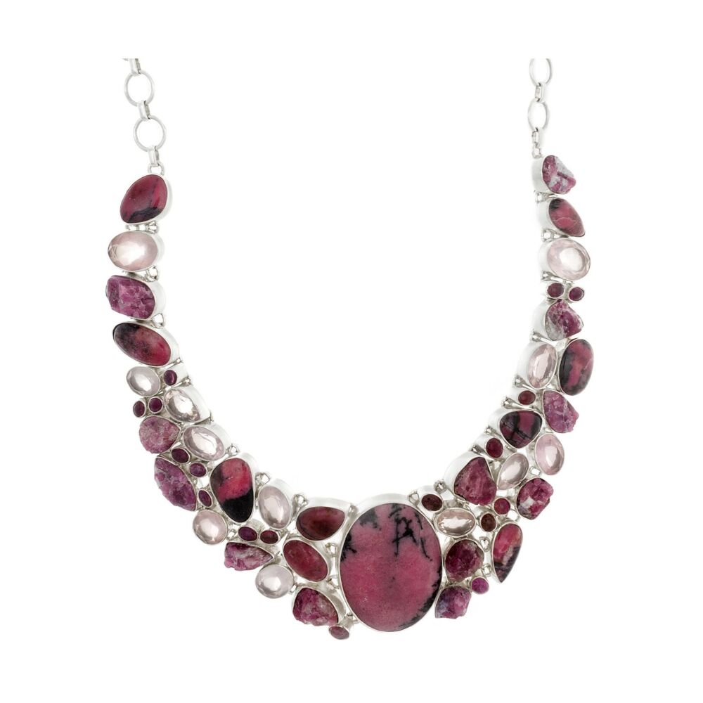 <font size="4"><span style="font-family: "EB Garamond";"><font size="4"><span style="font-family: "EB Garamond";"><font size="4">An eloquent polished Rhodonite center stone makes a colorful statement. This gem quality centerpiece is accented by Faceted Rose Quartz and Natural Pink Tourmaline. All handcrafted and individually set this breathtaking ensemble would make a brilliant addition to one's personal collection.</font></span></font></span></font> Rhodonite Necklace Collar With Faceted Rose Quartz & Natural Pink Tourmaline