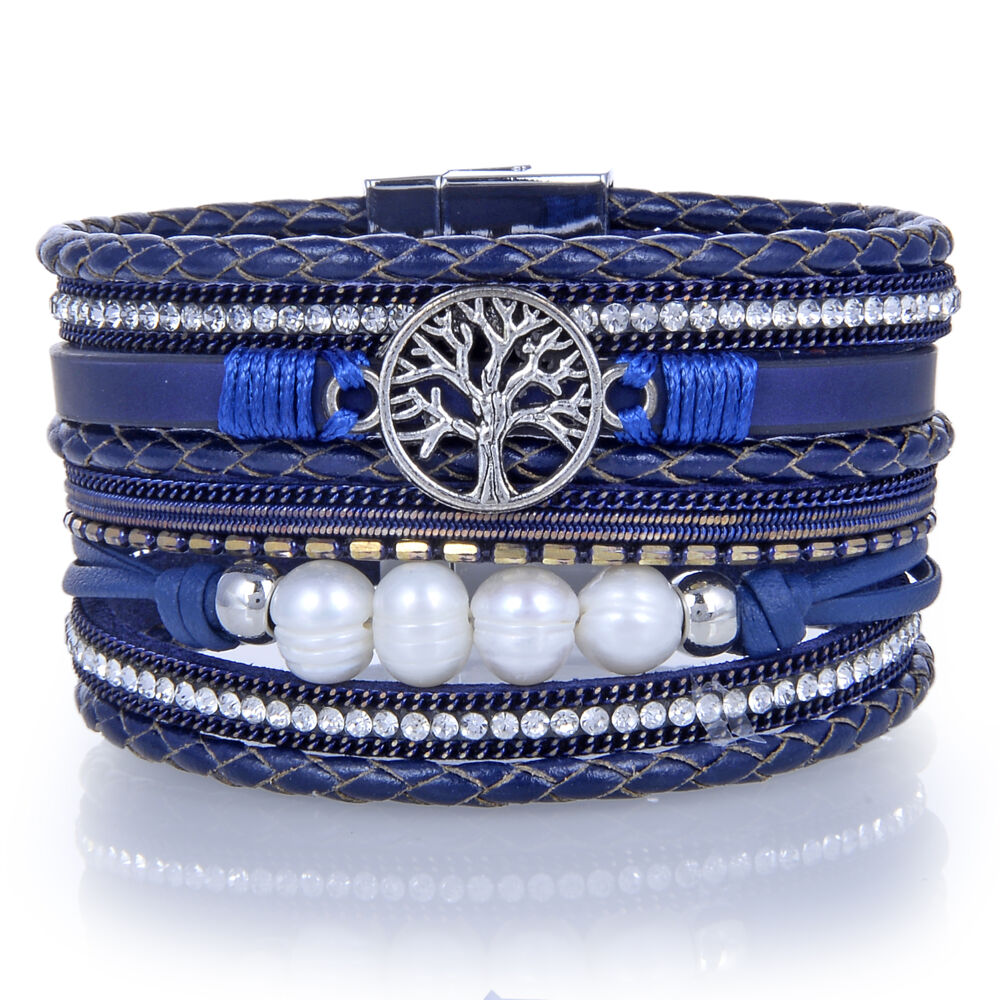 Our Tree of Life Multi Wrap Bracelet is casual enough for everyday but will add pizzazz to any outfit. The tree of Life symbol in the center brings positive energy and good health. There are natural pearls accenting the Navy and silver Multi Wrap straps. This Multi Wrap Bracelet has a magnetic clasp for a secure hold and easy on/off access. Navy Tree Of Life Multi Wrap Bracelet