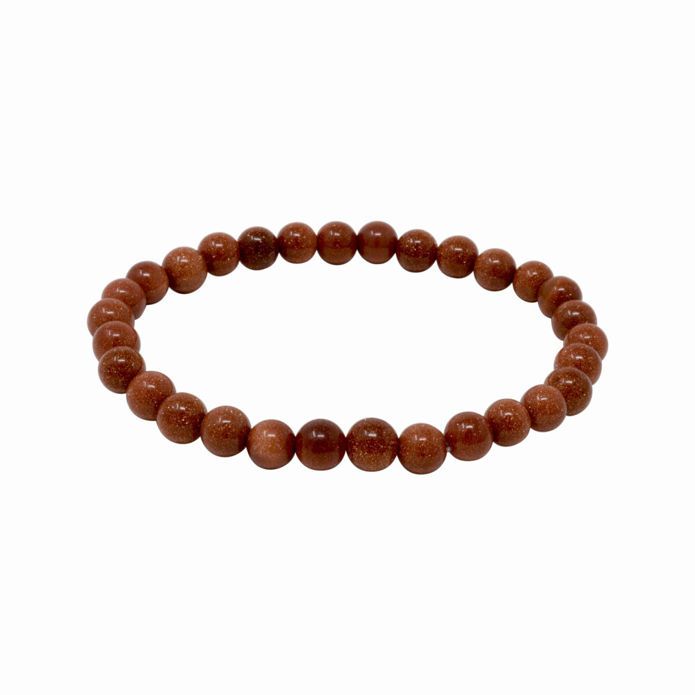 This 6mm round Red Goldstone bracelet is filled with sparkle. The Goldstone beads are held together with multiple strands of elastic. It slides on smoothly and stretches off easily. Red Goldstone shines and sparkles like no other. This is not by accident. Red Goldstone is a mixture of natural materials including copper particles fused with glass. This process is what gives it appealing color and sparkle. Red Goldstone is often mistaken, or misrepresented, for a natural material. Red Goldstone encourages a positive attitude, promotes vitality. For this reason it's called the stone of confidence and ambition. Red Goldstone Bracelet 6mm Rounds