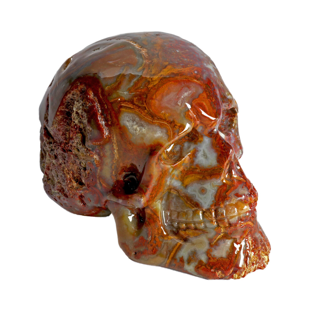 <span style="position: initial; margin: initial;"></span><span style="font-family: "EB Garamond"; position: initial; margin: initial;">Crazy Lace Agate Skull Small.</span><div style="position: initial; margin: initial;"><span style="color: rgb(0, 0, 0); font-size: 16.8px; font-family: "EB Garamond"; position: initial; margin: initial;">A cryptocrystalline form of silica, meaning the</span><br style="color: rgb(0, 0, 0); font-size: 16.8px; position: initial; margin: initial; font-family: "EB Garamond";"><span style="color: rgb(0, 0, 0); font-size: 16.8px; font-family: "EB Garamond"; position: initial; margin: initial;">crystals formed are so small they can’t be seen even under a</span><br style="color: rgb(0, 0, 0); font-size: 16.8px; position: initial; margin: initial; font-family: "EB Garamond";"><span style="color: rgb(0, 0, 0); font-size: 16.8px; font-family: "EB Garamond"; position: initial; margin: initial;">microscope! Crazy Lace Agate is predominantly white with bands of</span><br style="color: rgb(0, 0, 0); font-size: 16.8px; position: initial; margin: initial; font-family: "EB Garamond";"><span style="color: rgb(0, 0, 0); font-size: 16.8px; font-family: "EB Garamond"; position: initial; margin: initial;">creamy browns, and shades of varying reds. Identified by the narrow,</span><br style="color: rgb(0, 0, 0); font-size: 16.8px; position: initial; margin: initial; font-family: "EB Garamond";"><span style="color: rgb(0, 0, 0); font-size: 16.8px; font-family: "EB Garamond"; position: initial; margin: initial;">concentric and angular bands. Energetically, this agate’s vibrations</span><br style="color: rgb(0, 0, 0); font-size: 16.8px; position: initial; margin: initial; font-family: "EB Garamond";"><span style="color: rgb(0, 0, 0); font-size: 16.8px; font-family: "EB Garamond"; position: initial; margin: initial;">are associated with sunny fiesta days, dancing and brings joy to the</span><br style="color: rgb(0, 0, 0); font-size: 16.8px; position: initial; margin: initial; font-family: "EB Garamond";"><span style="color: rgb(0, 0, 0); font-size: 16.8px; font-family: "EB Garamond"; position: initial; margin: initial;">wearer. A stone of support and encouragement, elevating thoughts</span><br style="color: rgb(0, 0, 0); font-size: 16.8px; position: initial; margin: initial; font-family: "EB Garamond";"><span style="color: rgb(0, 0, 0); font-size: 16.8px; font-family: "EB Garamond"; position: initial; margin: initial;">and promoting optimism, mental agility, liveliness and encourages</span><br style="color: rgb(0, 0, 0); font-size: 16.8px; position: initial; margin: initial; font-family: "EB Garamond";"><span style="color: rgb(0, 0, 0); font-size: 16.8px; font-family: "EB Garamond"; position: initial; margin: initial;">flexibility in thinking and action.</span><span style="font-family: "EB Garamond"; position: initial; margin: initial;"><br style="position: initial; margin: initial;"></span></div> Crazy Lace Agate Skull Small