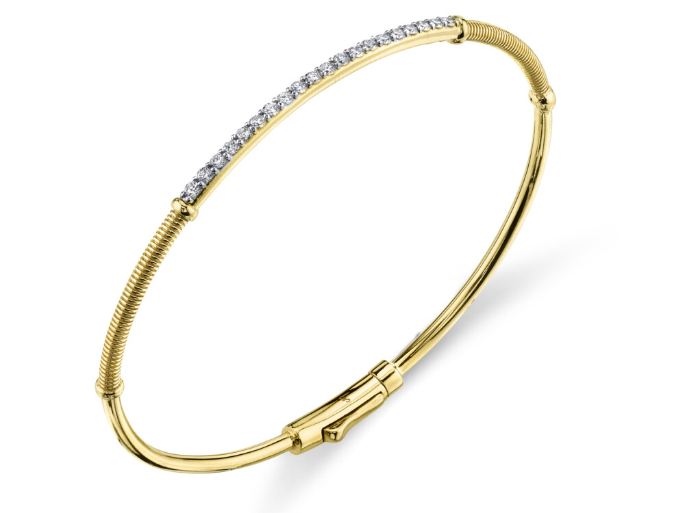 SLENDER AND CHIC, THIS SLOANE STREET PAVE WHITE DIAMOND BAR BANGLE BRACELET IN 18K YELLOW GOLD WITH SIGNATURE STRIE TEXTURED ACCENTS IS YOUR NEW EVERYDAY GO-TO. THE DOUBLE HINGE AND HIDDEN LOCKING CLASP MAKE IT AN EASY-TO-WEAR STAPLE. STACK IT UP WITH MULTIPLES OR WEAR ALONE FOR A CLASSIC AND CLEAN LOOK. Pave Diamond Skinny Bangle