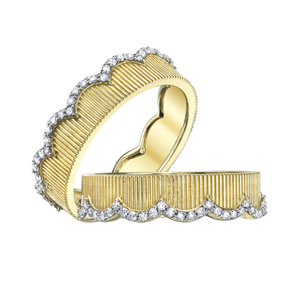 SLOANE STREET ICONIC SCALLOPED GUARD ETERNITY BANDS IN 18K YELLOW GOLD FEATURE RICH STRIE TEXTURE WITH WHITE DIAMOND EDGE DETAIL FOR AN ELEGANT TWO-TONE LOOK. THIS ELEGANT BOOKEND SET IS SO VERSATILE AND CAN BE WORN MANY DIFFERENT WAYS. STACK WITH A SIMPLE DIAMOND BAND OR A DIAMOND OR COLORED GEMSTONE SOLITAIRE TO TRANSFORM INTO A UNIQUELY FEMININE YET CLASSIC LOOK. Pave Diamond And Strie Scalloped Eternity Guard Bands