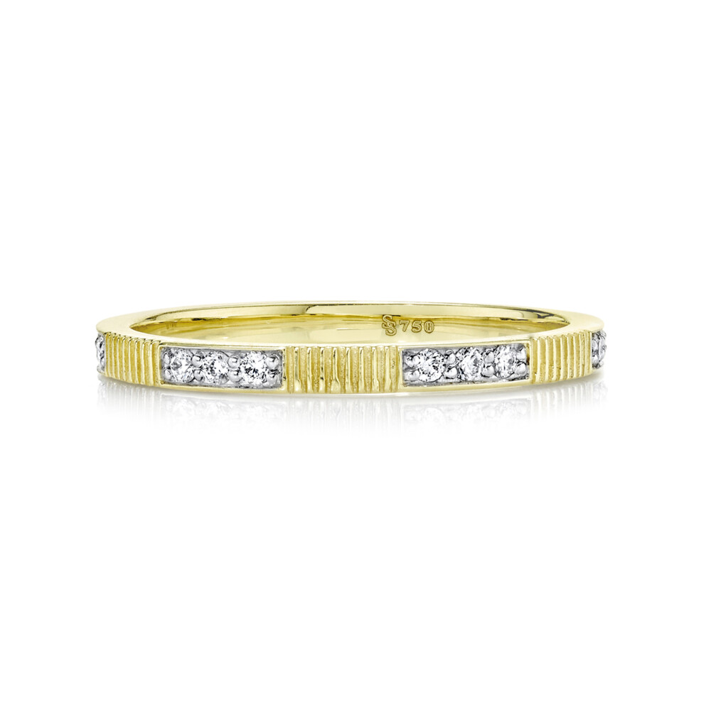 SLOANE STREET STACKER RING WITH PAVE WHITE DIAMONDS IN 18K YELLOW GOLD FEATURES 3 WHITE DIAMOND SECTIONS BROKEN UP BY RICH SIGNATURE STRIE TEXTURE DETAIL. THIS DELICATE 1.5MM WIDE BAND IS A GREAT LAYERING PIECE TO ADD TO ANY STACK FOR THE PERFECT AMOUNT OF SPARKLE. 1.5mm Diamond And Strie Band