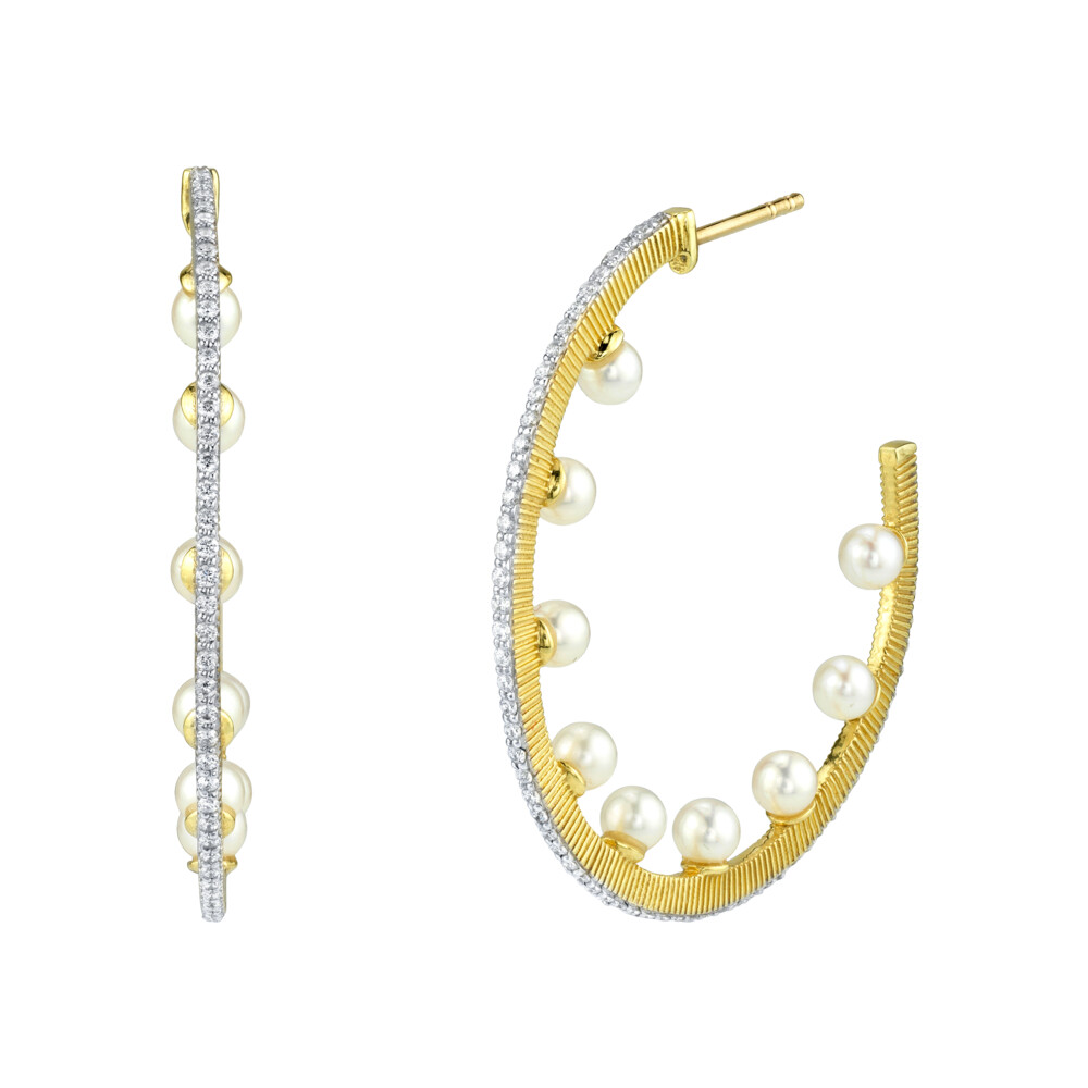 SLOANE STREET PEARL AND GLISTENING WHITE DIAMONDS HOOPS IN 18K YELLOW GOLD ARE A UNIQUE AND UPDATED TAKE ON A STAPLE FEATURING COLORLESS WHITE DIAMONDS RUNNING DOWN THE FRONT OF THESE CONTEMPORARY HOOPS WITH LUSTROUS PEARLS SET INSIDE THE HOOP CREATING A PLAYFUL LOOK FROM ALL ANGLES. Pave Diamond Hoop Earrings With Seed Pearls