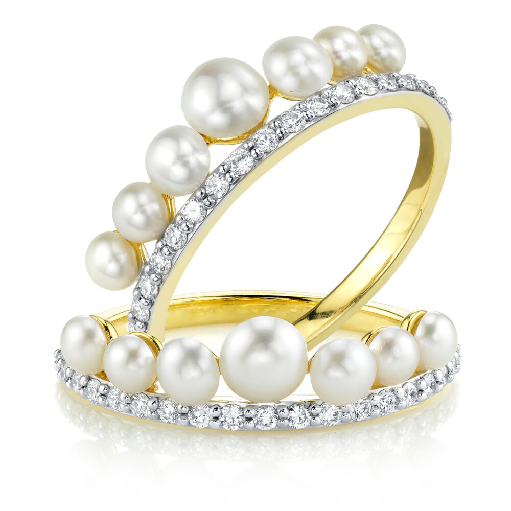 <span style="font-size: 16.8px; position: initial; margin: initial;">SLOANE STREET WHITE PEARL GUARD RINGS IN 18K YELLOW GOLD ARE A CONTEMPORARY TWIST ON A CLASSIC. WITH AN ELEGANT COMBINATION OF SPARKLING WHITE DIAMOND PAVE AND SWEET GRADUATING SEED PEARLS, THESE BOOKENDS HAVE PRINCESS LIKE QUALITIES CREATING A CROWN AROUND YOUR FINGER.</span> Seed Pearl And Pave Diamond Guard Rings