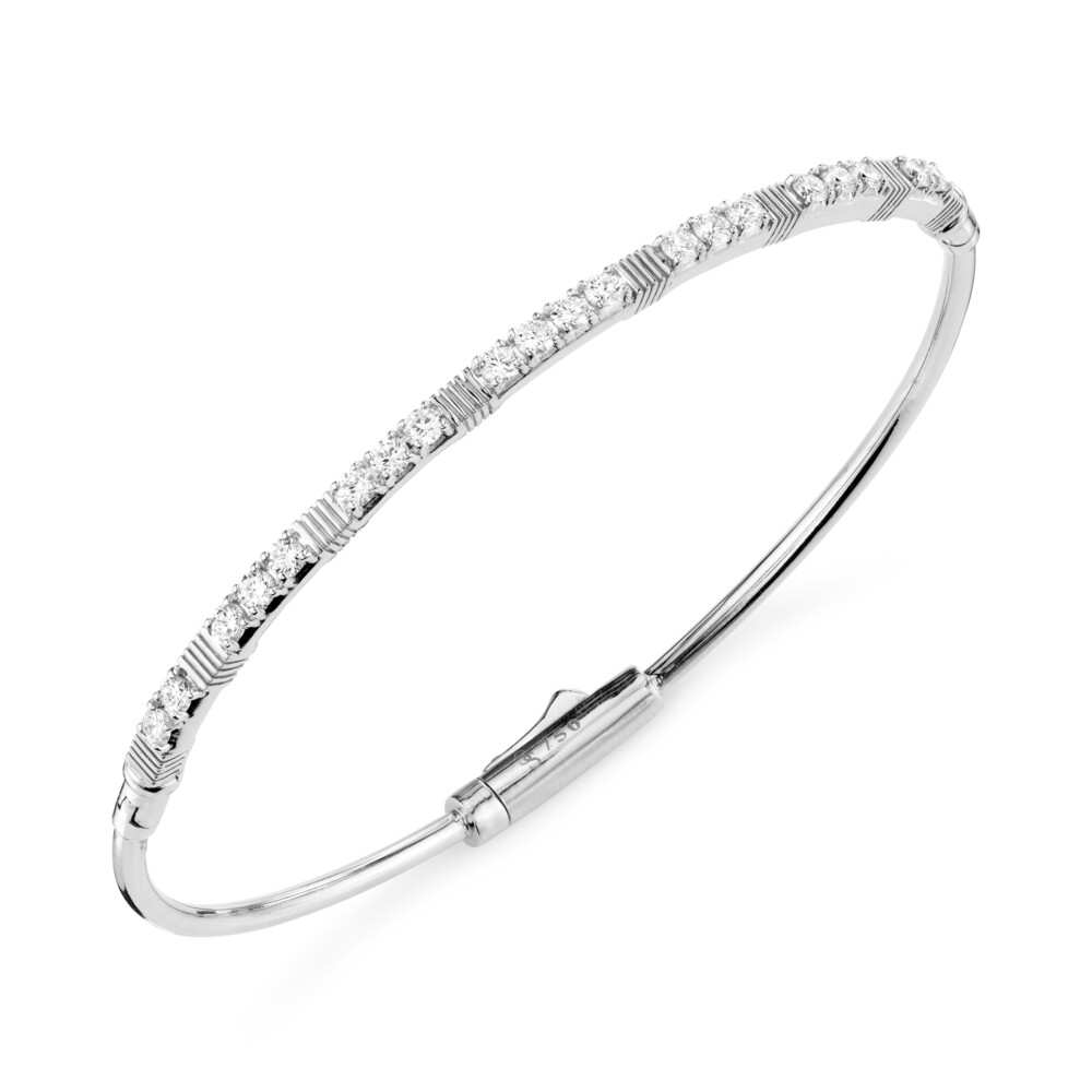 STUNNING AND EASY TO WEAR SLOANE STREET PAVE WHITE DIAMOND BRACELET IN 18K WHITE GOLD IS AN ESSENTIAL FOR EVERY WOMAN’S COLLECTION. THIS BANGLE BRACELET FEATURES 20 COLORLESS DIAMONDS THAT SPARKLE WITH EVERY MOVE COMPLIMENTED BY ELEGANT STRIE TEXTURED STATIONS WITH DOUBLE HINGE AND HIDDEN CLASP MAKING IT PERFECT FOR EVERY OCCASION. DIAMOND AND STRIE BANGLE