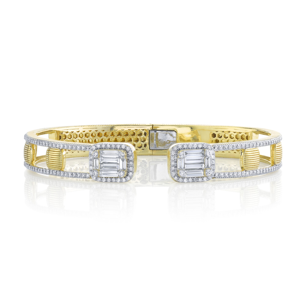 SLOANE STREET DIAMOND CLUSTER AND STRIE OPEN FRONT CUFF BRACELET FEATURES TWO CLUSTERS OF PRECISION CUT SPARKLING BAGUETTE DIAMONDS CREATING AN ILLUSION OF A 3CT SINGLE STONE ON EACH SIDE WITH DELICATE WHITE DIAMOND PAVE HALOS AND FEMININE STRIE CUSHION STATIONS SET OFF BY WHITE DIAMOND EDGING CREATING WHIMSICAL AIRSPACE WITH SPRING OPEN FRONT MECHANISM. THIS ELEGANT BRACELET CREATES A BIG SHOWSTOPPING LOOK. Strie And White Diamond Baguette Illusion Open Front Cuff