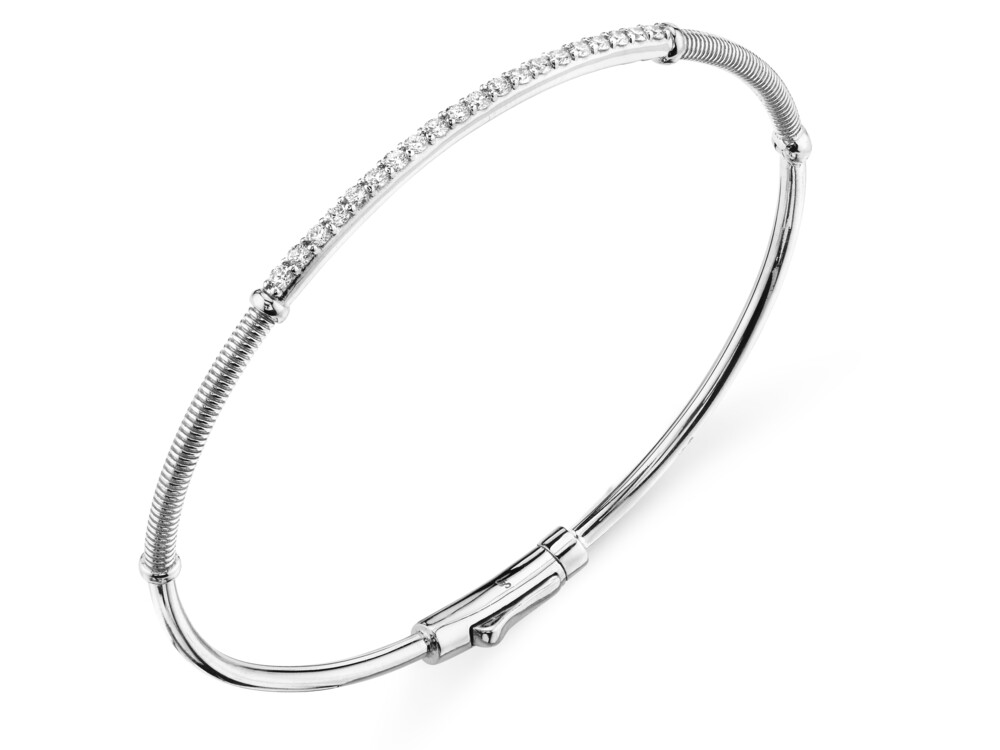 SLENDER AND CHIC, THIS SLOANE STREET PAVE WHITE DIAMOND BAR BANGLE BRACELET IN 18K WHITE GOLD WITH SIGNATURE STRIE TEXTURED ACCENTS IS YOUR NEW EVERYDAY GO-TO. THE DOUBLE HINGE AND HIDDEN LOCKING CLASP MAKE IT AN EASY-TO-WEAR STAPLE. STACK IT UP WITH MULTIPLES OR WEAR ALONE FOR A CLASSIC AND CLEAN LOOK. Pave Diamond Skinny Bangle