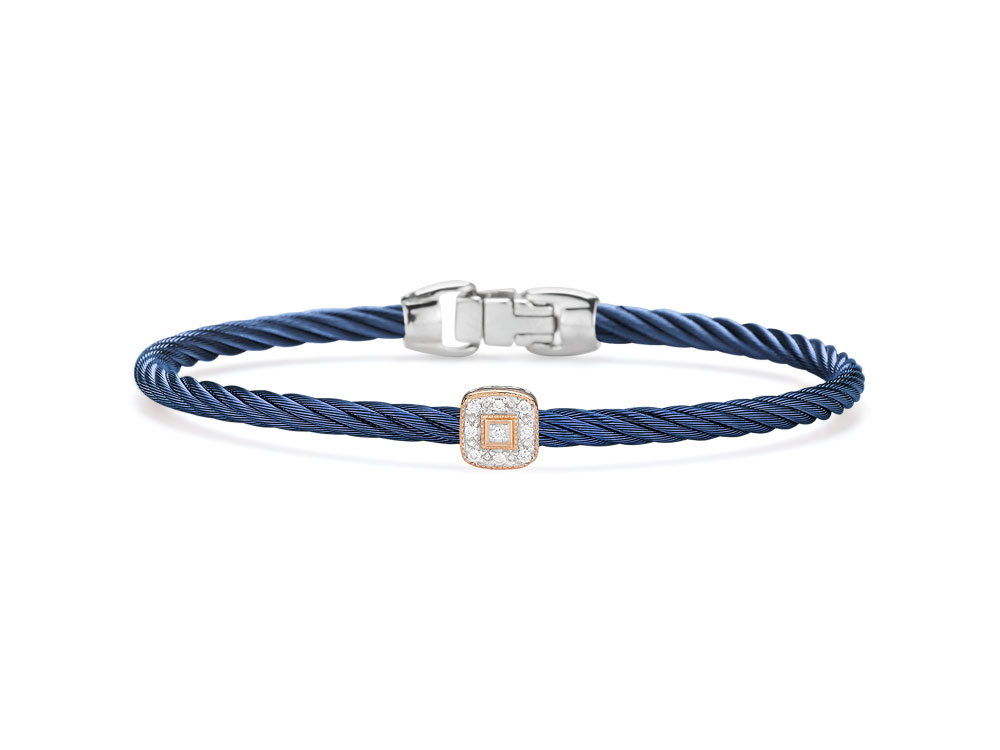 This heat treated blueberry colored steel cable features a single square 18k rose gold station. With a total carat weight of .05cts, this bangle is perfect to pair with others or just to wear alone. Blueberry Single Squared Station Bangle