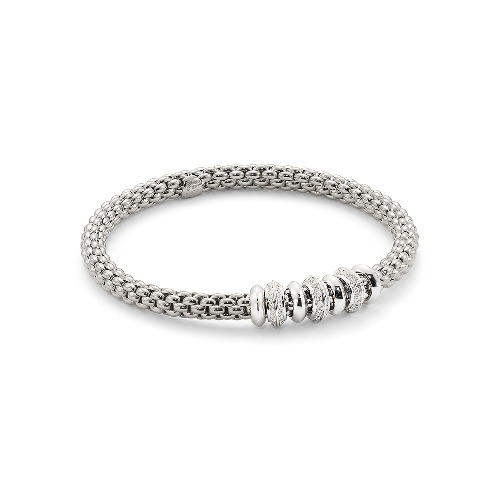 This 18k yellow, rose or white gold Fope stretchy bracelet with diamonds is extremely unique and timeless. Fope stretchy and flexible bracelets are unique in that they the only bracelet of this kind that is made of pure 18k gold. This handcrafted Italian bracelet is perfect either by itself or stacked alongside other bracelets and bangles. 18k Gold Stretch Fope Bracelet With Diamonds
