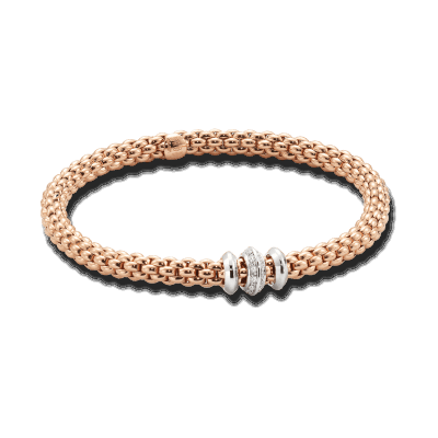 The Solo collection brings a new contemporary slant to Unica, the brand’s best-selling range in the Nineties. The bracelet’s gold mesh is now flexible, the proportions are slightly smaller than the thicker chains in vogue at the time, and there are numerous new versions with gold loops, pearls and diamonds in different carats. The matching set also includes chokers, chain and tassel necklaces, earrings and rings. The effortless simplicity of every Fope Bracelet ensures that you don't have to sacrifice your comfort for fashion. Classic yet fashion forward, this is most certainly not your grandmothers jewelry, each piece of FOPE gives an aura of intelligence and sophistication to those who wear it. Each bracelet has over 100 tiny 18k gold coils set into the interior of the link that allows the bracelet to expand and contract, rolling perfectly onto your wrist with ease. Handcrafted Entirely in Italy from 18k Gold and Diamonds, This Solo Flex'it bracelet in size Medium features three rondels: two white gold rondels and one diamond encrusted rondel, 0.17cts, of VS F/G diamonds. FOPE Flex'it bracelets are made in Five Sizes - Extra Small(15cm.), Small(16cm.), Medium(17cm), Large(18cm), and Extra Large(19cm). Standard size is considered Size Medium and does fit most people. There’s a price difference between each size so please reach out to us for pricing information. Size/Color available for immediate shipment: 1. Size medium bracelet in rose gold with white gold rondels. 2. Size medium bracelet in yellow gold with white gold rondels. All other sizes/colors will be ordered with a 4-6 week wait. FLEX'IT Solo 18k Gold Bracelet