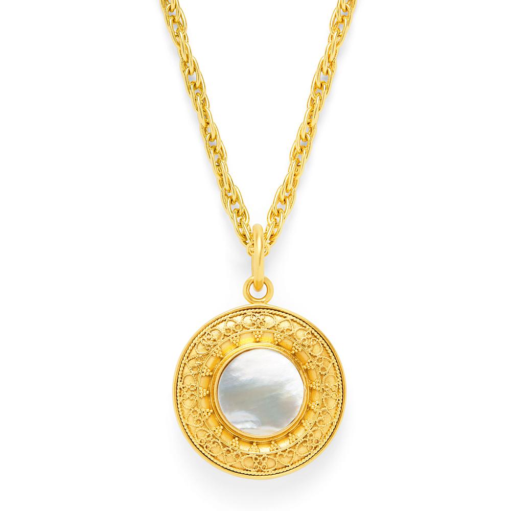 Richly textured double sided pendant: freshwater pearl on one side, mother of pearl or stone on the other. 24k gold plated over nickel free brass. Sofia Gold Pendant