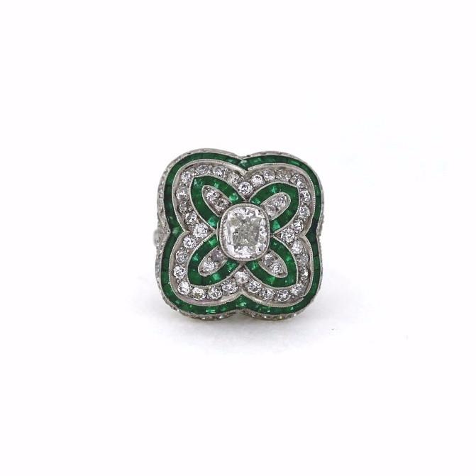 This genuine Art Nouveau Lady's ring is constructed of platinum, diamonds, and emeralds. Diamond weight is 1.00 tcw, emerald carat weight is 1.78 tcw. Cushion Cut Diamond and Emerald Ring