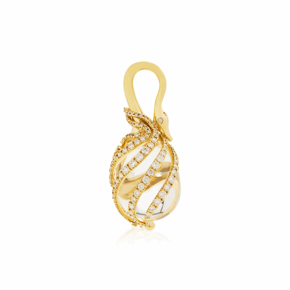 This beautiful, one of a kind amulet is natural rock crystal encapsulated by 18K yellow gold and enhanced with 2.834 carats of white diamond. If you look closely, you will notice that instead of a bail, there is a carefully crafted swans head. The total height of this amulet, including the bale, is 47mm and weighs approximately 26.6g. This amulet is an exotic statement piece that will add a sophisticated elegance to any outfit, day or night. 18k Swan Amulet - Medium