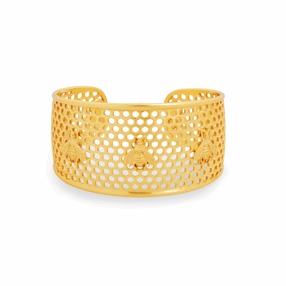 Whimsical bees decorate a statement honeycomb cuff. Adjustable to fit all wrists. 24K gold plate. Julie Vos hallmark. Honeycomb Cuff