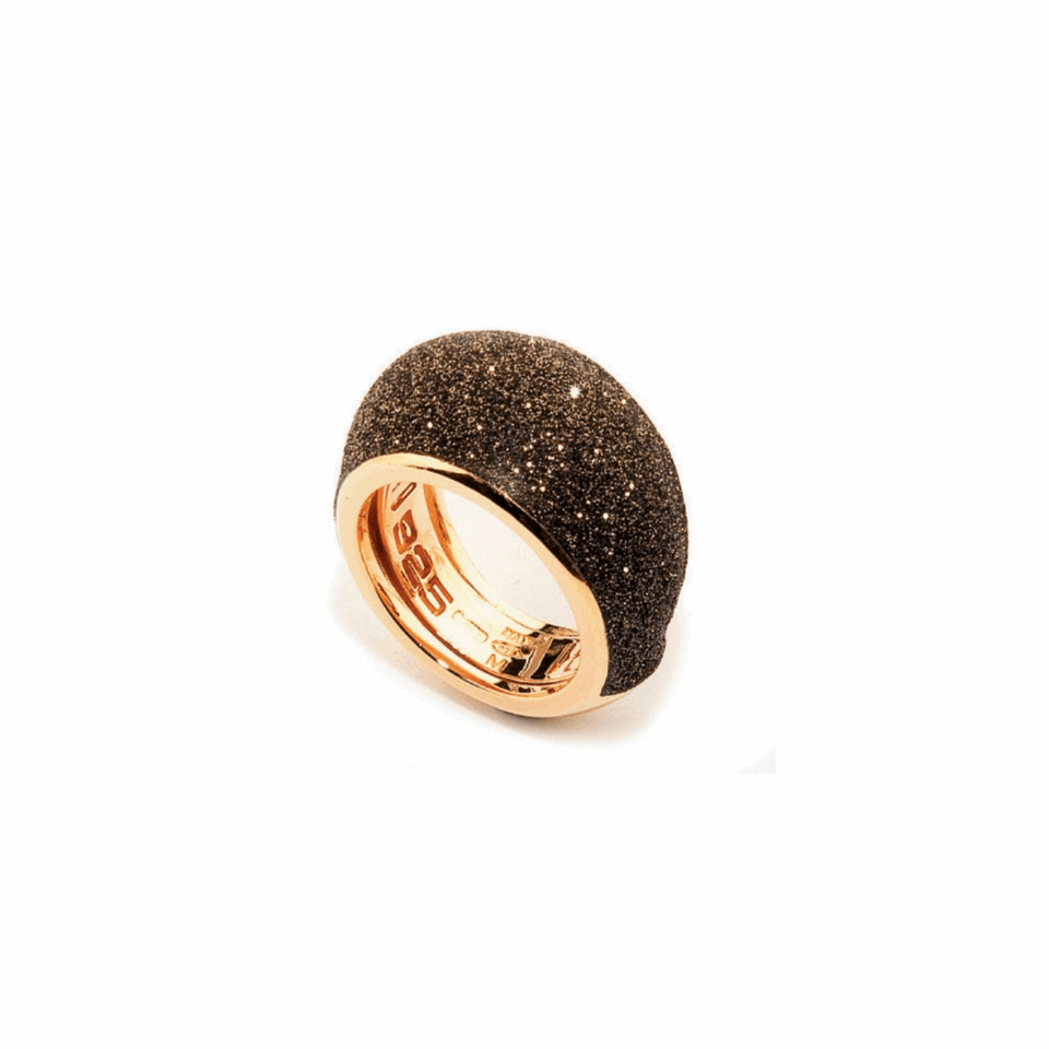 Small Dome Polvere Di Sogni Ring. Sterling Silver with an 18K Rose Gold Vermeil. Ring contains adjustable butterfly tine along interior of the ring for easy sizing. Small Dome Polvere Di Sogni Ring - Rose Gold & Dark Brown Dust