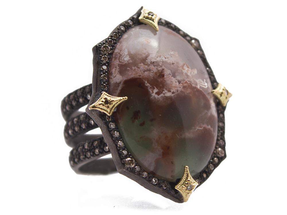 Armenta presents this Old World Collection triple band ring. Displayed in blackened sterling silver with prongs of 18k yellow gold featuring their own diamond stations: while also resting on a halo of champagne diamonds. With a center set oval aquaprase cabochon this ring is perfect for everyday outings. Aquaprase Cabochon Ring