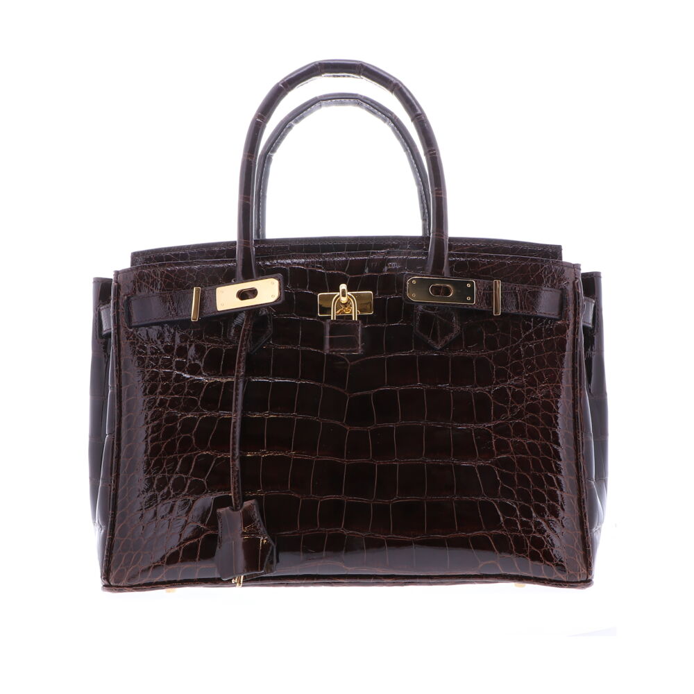 Genuine American Alligator Leather Satchel with a premium high gloss chocolate brown finish. The interior of the bag is finished with a light gray garment quality suede, and a large zipper compartment. This keeps the satchel light and durable. Gold plated Italian palladium hardware. Four gold plated handbag feet. Classic 30 Chocolate Brown Alligator