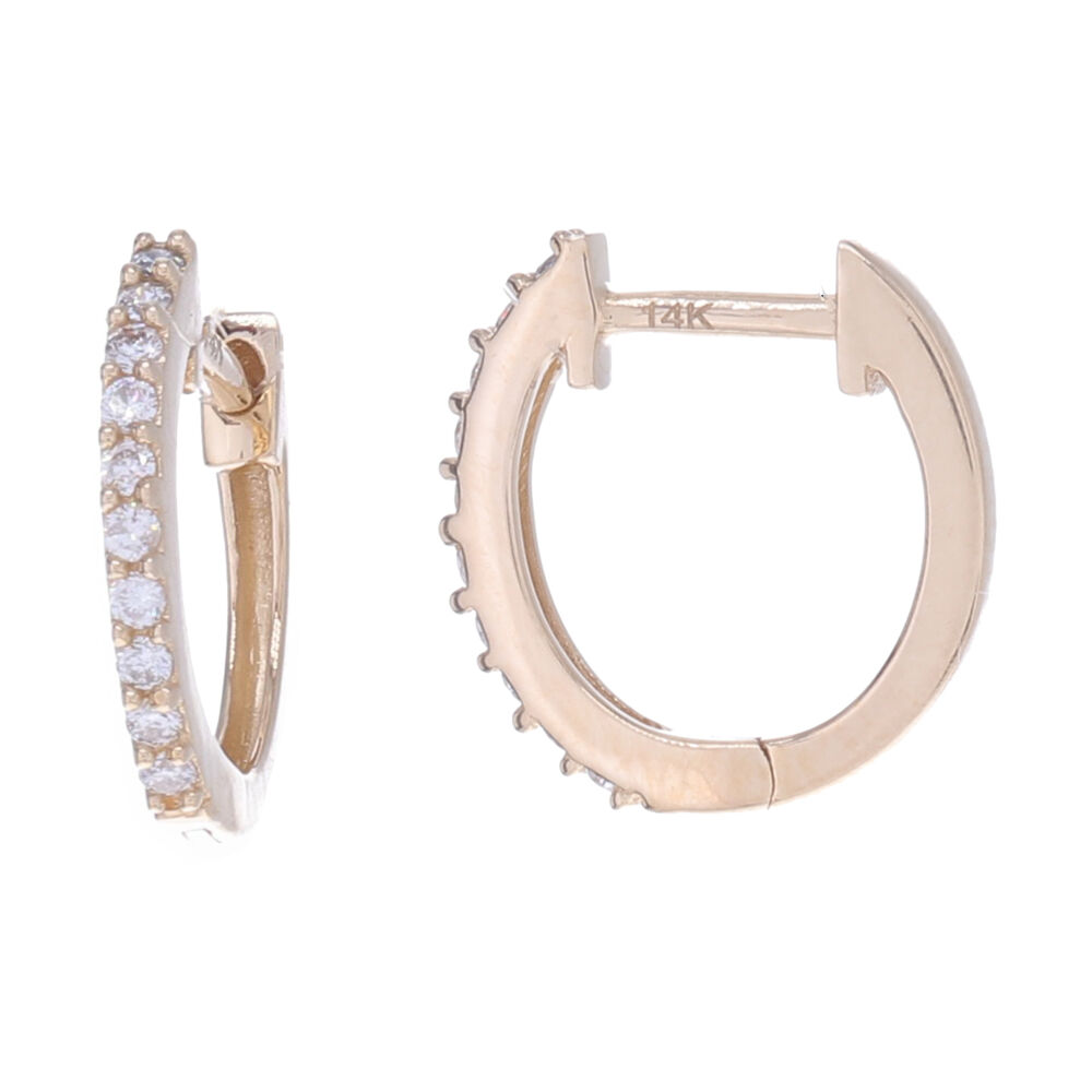 These 14k yellow gold simple hoops, feature 10 small diamonds down the front of the hoop. Pair these with a charm to let them dangle, or just wear alone for a perfectly chic look. Small Diamond Huggies