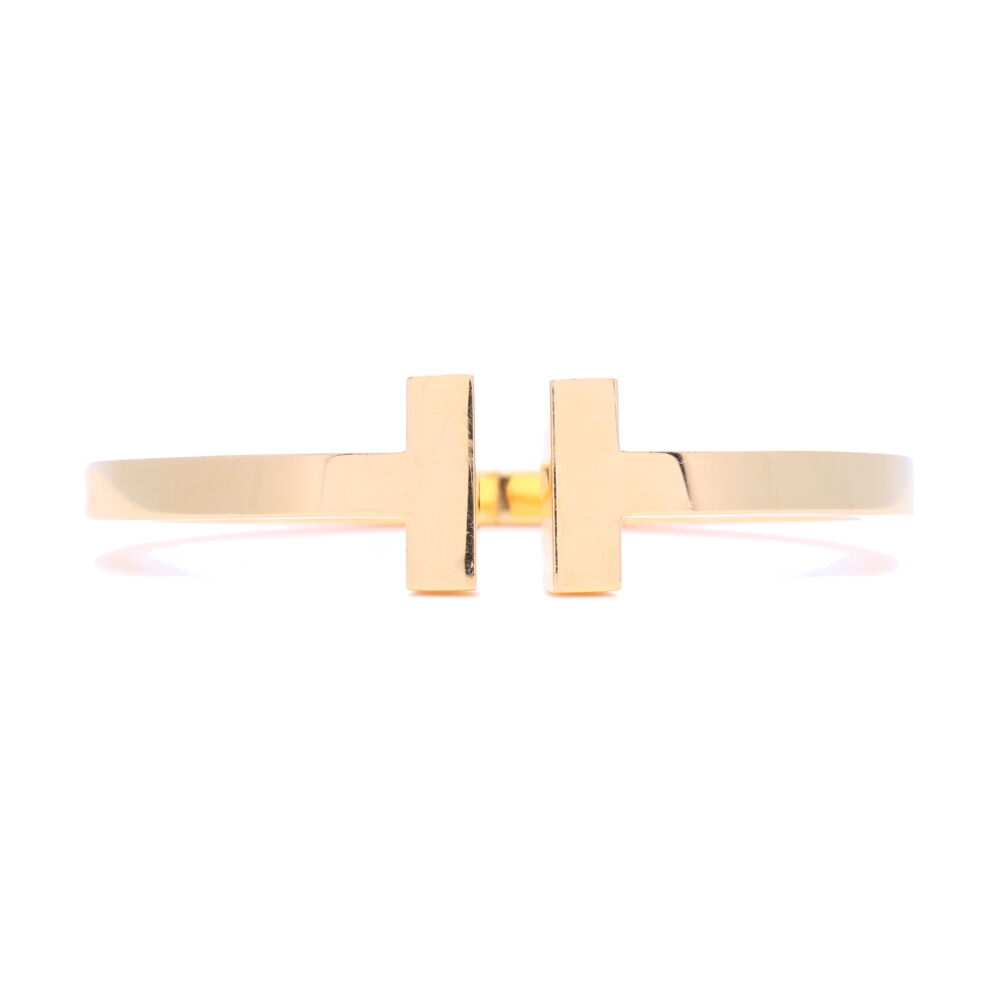 Estate Tiffany T Square Bracelet, Hallmark Au750 T&Co. ITALY - Bangle shows signs of normal wear but could definitely be polished to get a "like new" high polish, is being sold as is ,no original packaging, LaNae Fine Jewelry can not independently verify it's authenticity. Estate Tiffany T Square Bangle