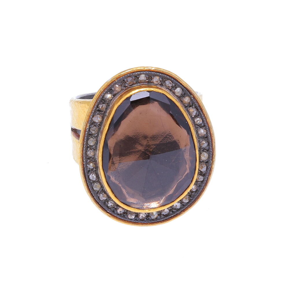 This 24 karat gold and sterling Kurtulan ring with smokey quartz can easily be worn as a an every day ring. Casual enough to wear with jeans but large enough to be worn alone. Kurtualan is a Turkish designer, this ring has been imported. Kurtulan 24k Gold and Smokey Quartz and Diamond Ring
