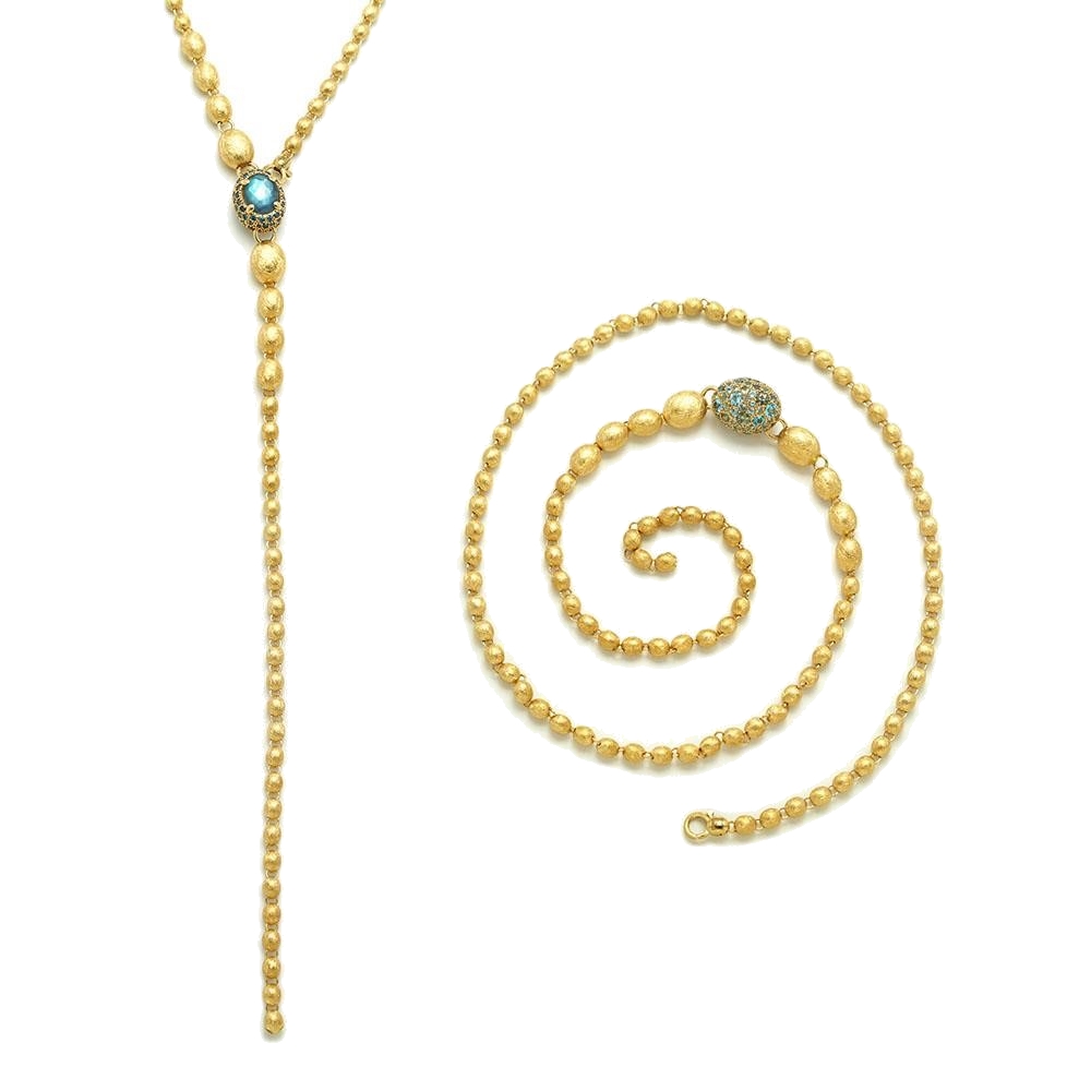 This dancing reverse necklace in 18kt yellow gold and diamonds is made from elegant gold pearls, hand-engraved one by one with the very ancient burin technique and surprisingly light. Versatile in style, wear as a long chain or lariat in addition to being able to reverse the accent bead, it will easily become your favorite necklace. Yellow Gold London Blue Topaz Reverse Necklace