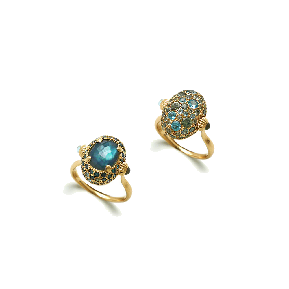 With REVERSE rings, luxury marries creativity: with a simple rotation this ring will show you its other side. REVERSE alternates a doublette with Mother of pearl and LONDON Blue Topaz and pavè of Blue Diamonds, Green Sapphires and Swiss Blue Topaz. You'll love choosing which side to wear, reflecting your mood. Dancing Reverse Ring