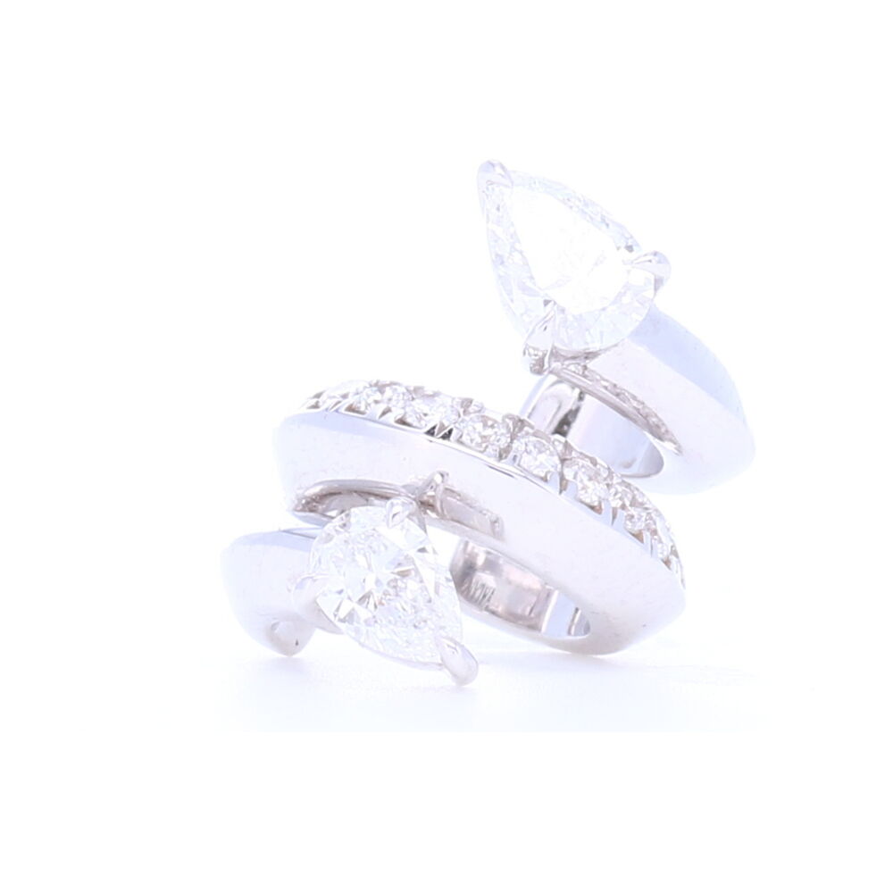 This 18K white gold statement ear cuff is set with Pear and Brilliant Cut Diamonds. Designed in New York City and handcrafted in Italy. Diamond Ear Cuff with Pear Shaped Diamonds