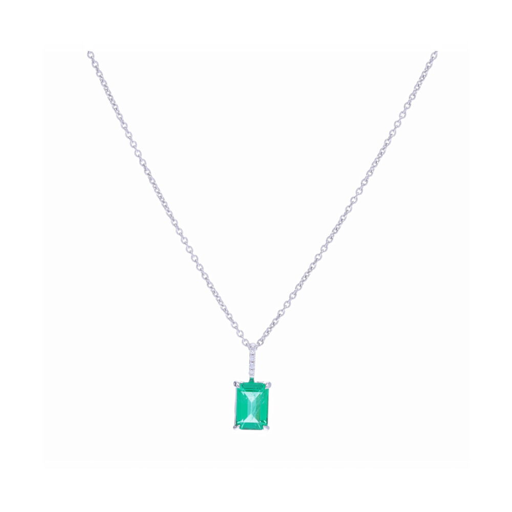 This lustrous emerald cut Zambian emerald pendant weighs in at 0.83 carats and is set into 18k white gold with a diamond pave on the bale. A perfect every day pendant - celebrate a May birthday for yourself or a loved one. Emerald Cut Zambian Emerald Pendant Necklace