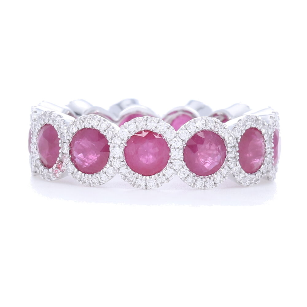 This resplendent ruby ring features an eternity band of sublime rubies haloed with diamonds. Set in 18k white gold, and with a total carat weight of 4.50 carats, these rubies are bound to catch anyones eye.
Halo Set Ruby Eternity Ring