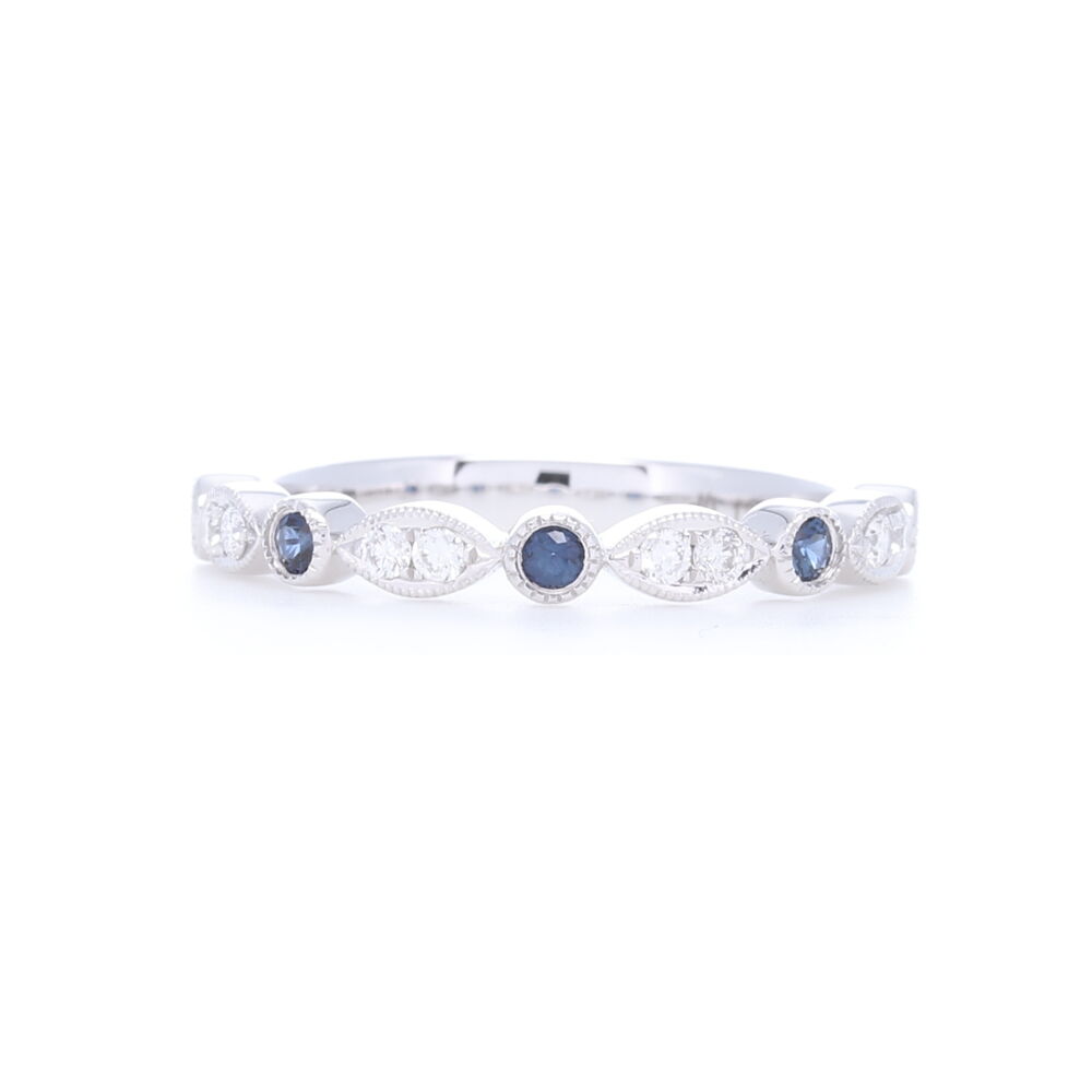 .13 carats of diamonds and .16 carats of sapphires are beautifully set in 14k White gold with an alternating marquis and round pattern. Brighten up any stack ring set with this pop of color. 14k White gold Sapphire and Diamond Stack Ring