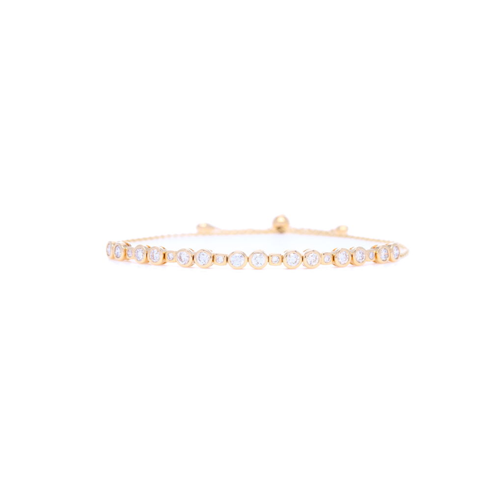 This 14k yellow gold .85 carat bezel set diamond bolo bracelet is unique and versatile. This elegant bracelet can be worn stacked or alone, on a night out on the town or day-to-day, which ever way you chose. 14k Yellow Gold Bezel Set Diamond Bolo Bracelet