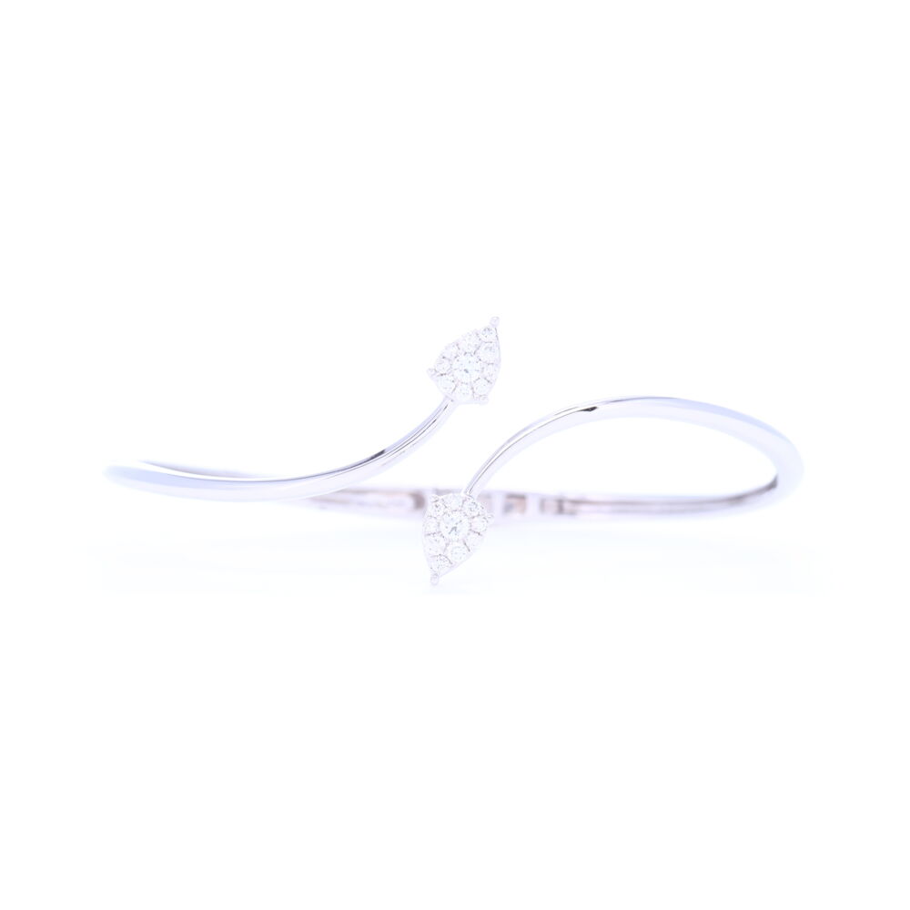 This 14k white gold bracelet has .37 carats of round, prong set diamonds. This unique and elegant bracelet can be worn on its own or with other bangles, making it versatile and ready to be paired with any look. 14k White Gold Round Diamond Bracelet