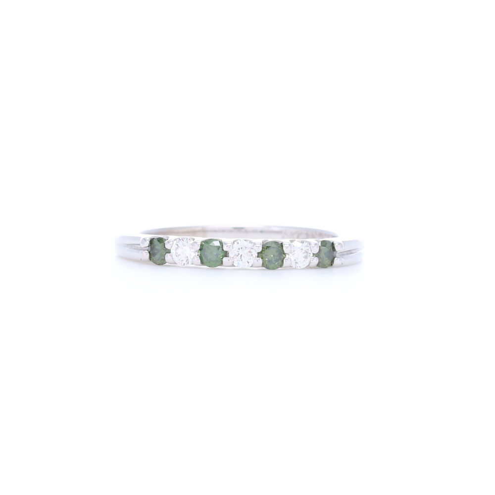 This 14k white gold prong set green and white diamond ring is stunning. Simple and sleek, this size 7 ring contains .35 carats of total diamond weight and is perfect for everyday wear. This ring is also perfect to stack with other rings. 14k White Gold Prong Set Green and White Round Diamond Ring
