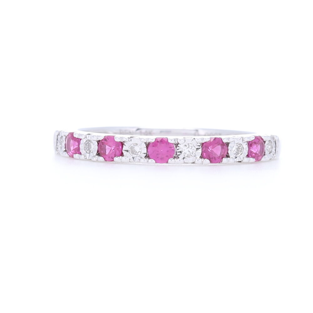 1/2 pattern alternating ruby and diamond prog set stack ring has .3 carats of rubies and .9 carats of diamonds set into 14k white gold. Elegant and timeless this will add that burst of color to your stack ring set. 14k White Gold 1/2 Ruby and Diamond Prong Set Stack Ring