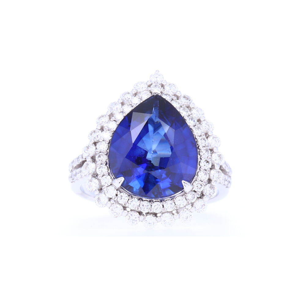 Wow, this 6.07 carat diffused Sapphire ring is flanked by stunning brilliant cut prong set diamonds in a halo that is set in 14k white gold. A statement for sure! 14k Halo Brilliant Cut Diamonds Around Diffused Pear Shaped Sapphire Ring