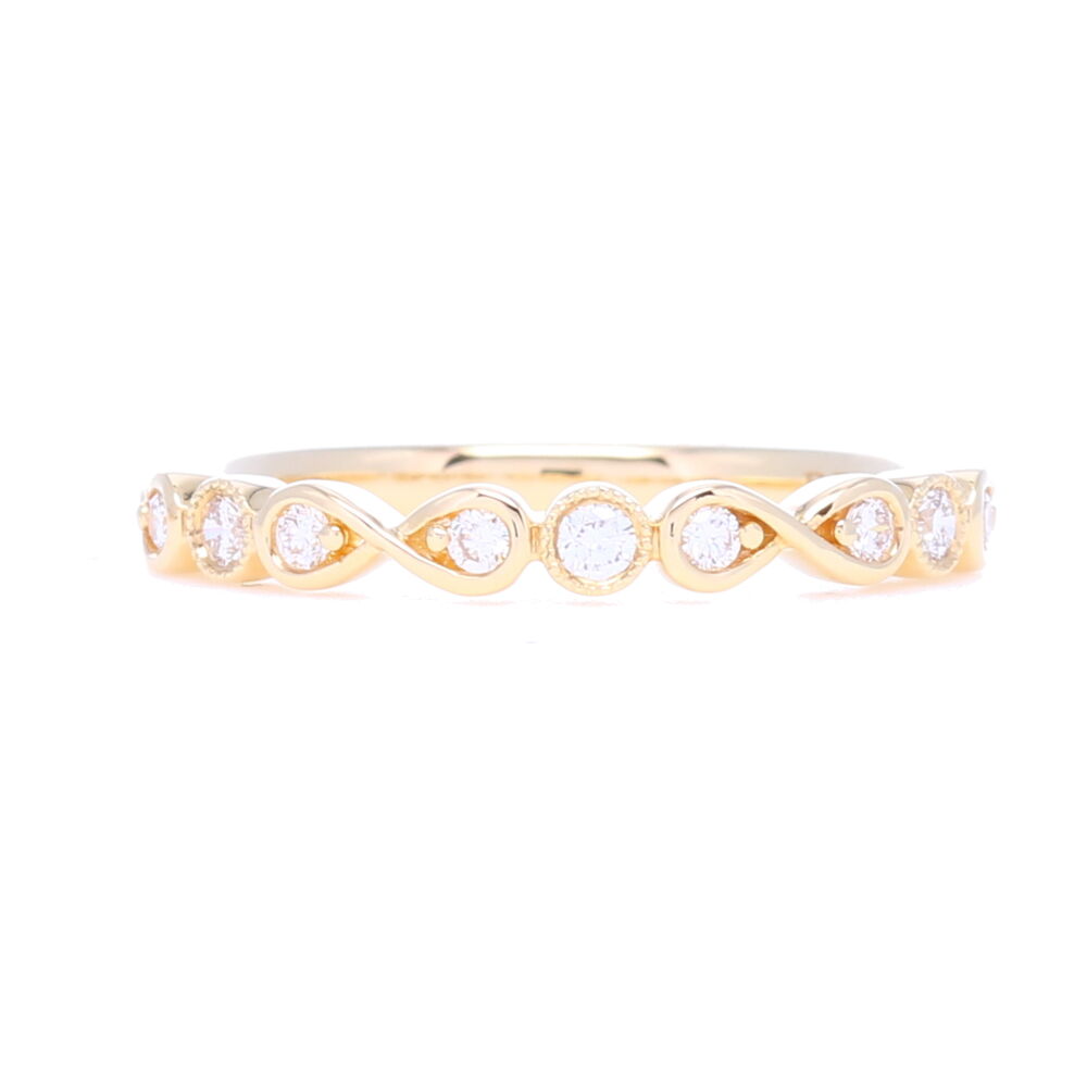 This 1/2 pattern stack ring band has a beautiful pattern of prong and bezel set diamonds for a total carat weight of .16. This ring is set in 14k Yellow gold. Prong Round & Bezel Set Diamond Stack Ring
