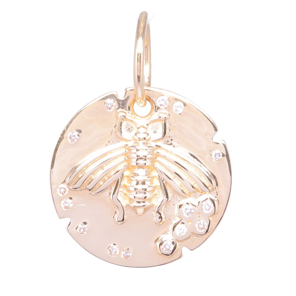 This small 14k gold and diamond bee medallion charm is perfect for being a layering charm or a delicate charm on it's own. It contains 2.05 g of 14k gold and .07 carats of diamonds. The irregular pattern of diamonds and small notches cut out from the side give this piece a truly unique look. This charm can fit on a chain up to 7mm in gauge but is often worn with one of the open-able ring chains or a delicate chain you might already have. Stunning way to show affection for the most amazing creature on earth - bees! 14k Yellow Gold Small Bee Medallion Pendant with Diamonds