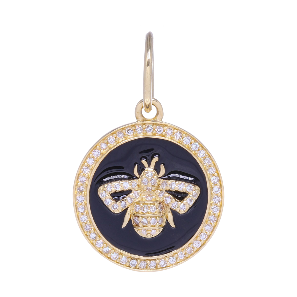 This small 14k gold and diamond and enamel bee medallion charm is perfect for layering. It contains 2.90 g of 14k gold and .17 carats of diamonds. The black enamel is perfect for adding contrast to an already stunning charm. This charm can fit on a chain up to 7 mm in gauge but is often worn with one of the open-able ring chains. Stunning way to show affection for the most amazing creature on earth - bees! Small 14k Gold and Diamond and Enamel Bee Medallion