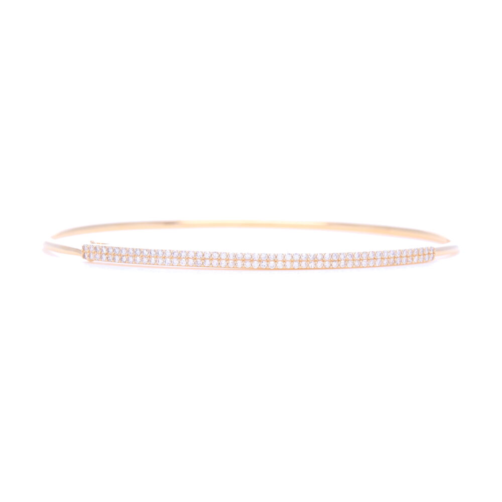 This 14k yellow gold tension hook bangle bracelet has two rows of pave set diamonds, totaling .4 carats of diamonds. This oval shaped petite and timeless bangle can be either be paired with other bangles or worn alone. 14k Yellow Gold 2 Row Pave Diamond Tension Bangle Bracelet