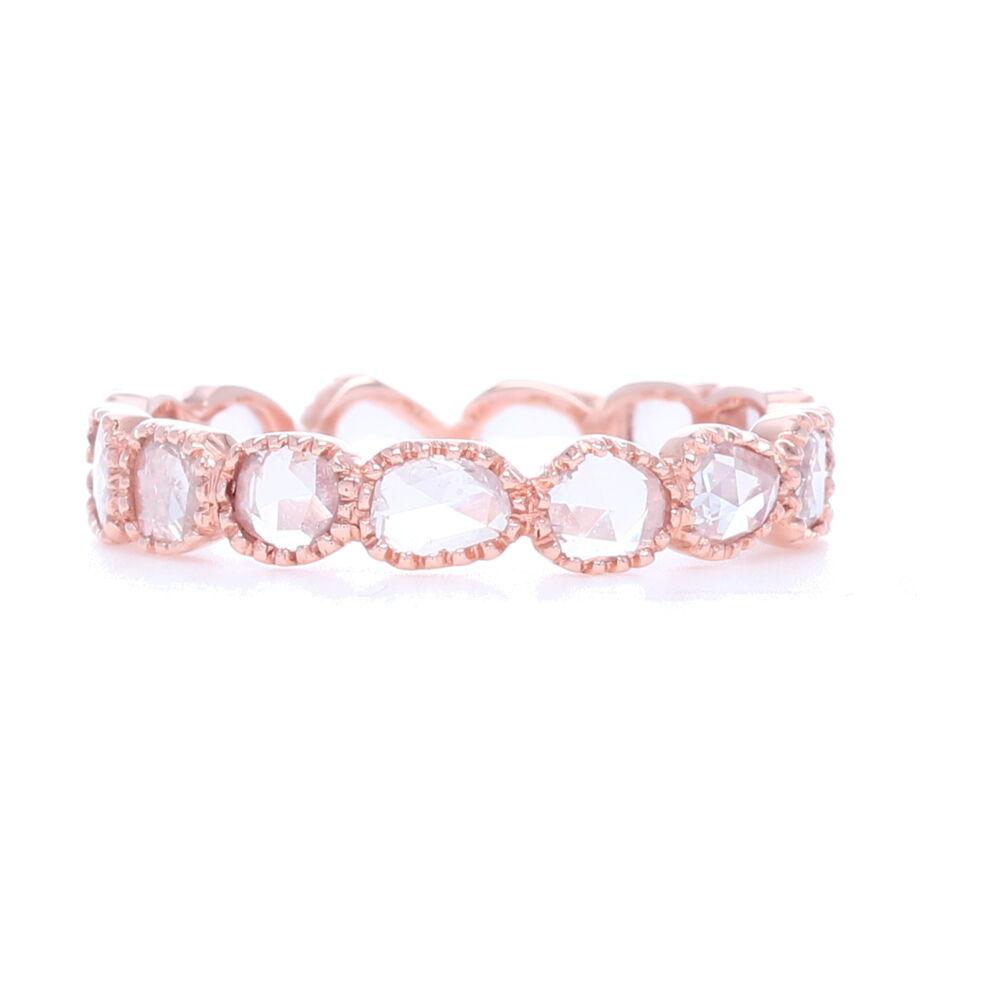 Rose cut diamonds bezel set in 18k rose gold give this stack band such a unique look. Adds texture and negative space to any stack ring set. Contains 1.13 total carat weight of diamonds. "Maya" White Diamond Rose Cut Band In 18k Rose Gold
