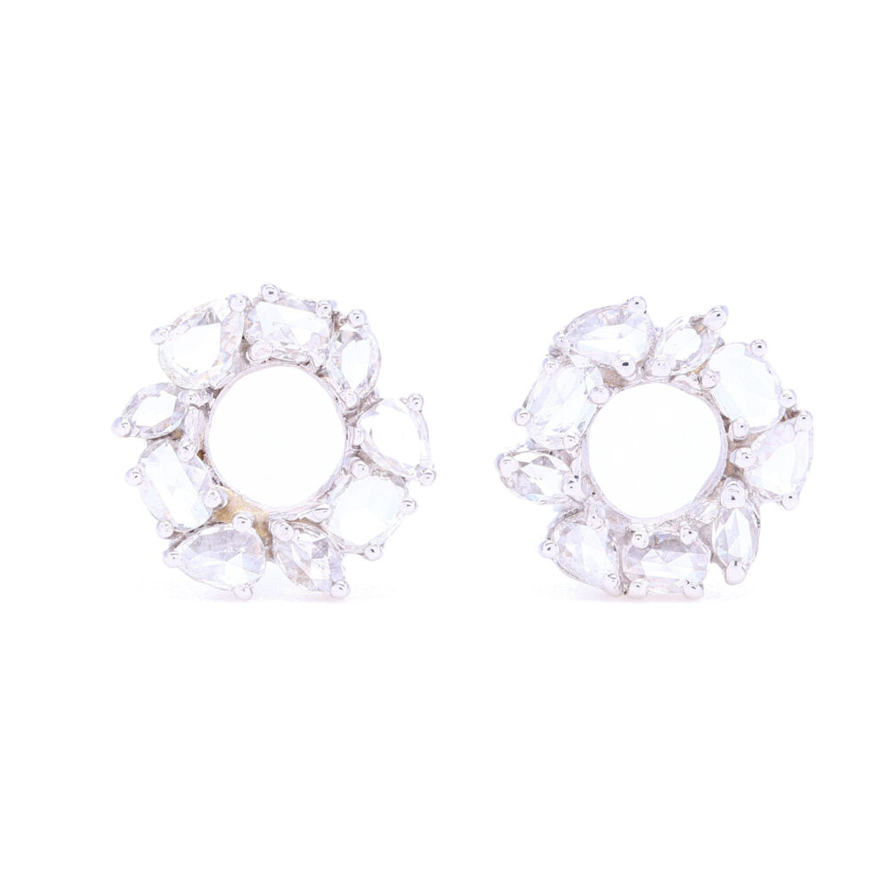 Not your grandmother's diamond studs, these have a personality. Eclectic mix of stone shapes make these studs something you'll fall in love with. Rose cuts scream elegance and casual at the same time. With .52 total carat weight, these pack enough sparkle to draw attention but can easily pass as your everyday earrings while still being understated. Set in 18k white gold. Mix Shaped Rose cut Diamond Earrings in