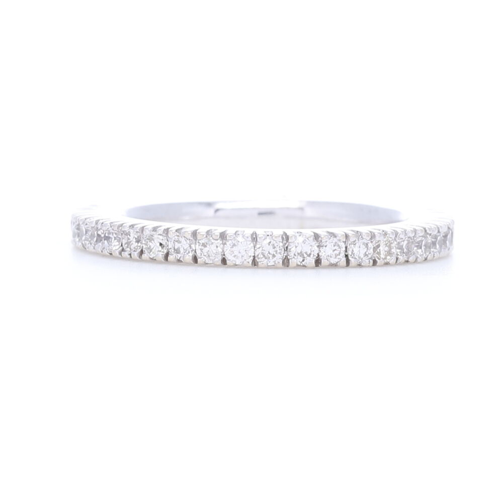 Lovely little stack ring, white diamonds are prong set in this 18k white gold eternity ring. Total carat weight of .65, perfect addition to any stack ring set or an engagement ring. White Diamonds Prong set in 18k White Gold Eternity Stack Ring