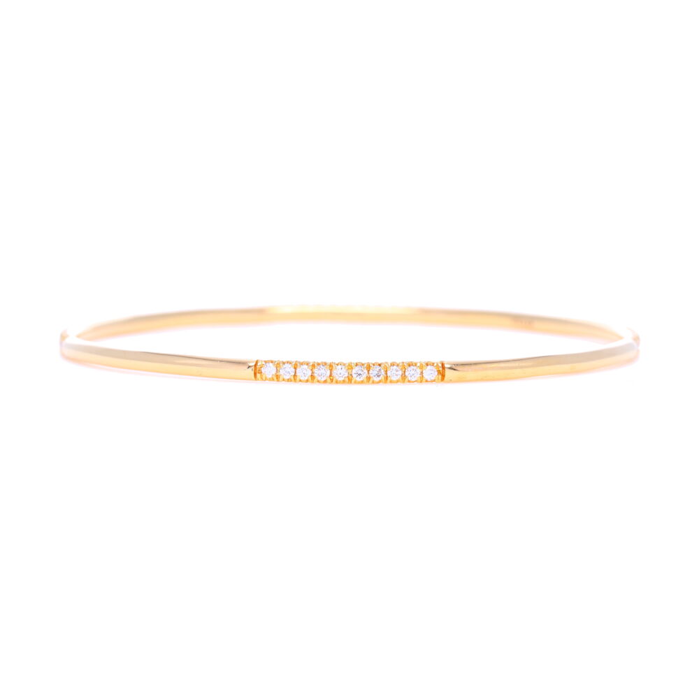 .69 carats of diamonds set into 18k yellow gold make this a classic bangle bracelet to add to any bracelet stack. White Diamonds Set in 18k Yellow Gold Bangle Bracelet