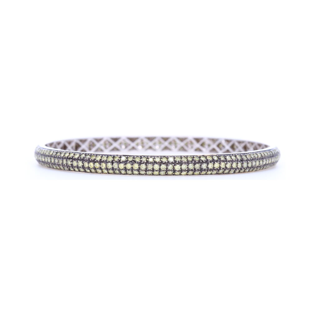 4.41 carats of green diamonds set into 18.51 g of 18k white gold would make anyone swoon for this arm candy. Everyone knows bracelets need friends, check out the other colors. Tyre Bangle Bracelet with Green Diamonds set in 18k White Gold