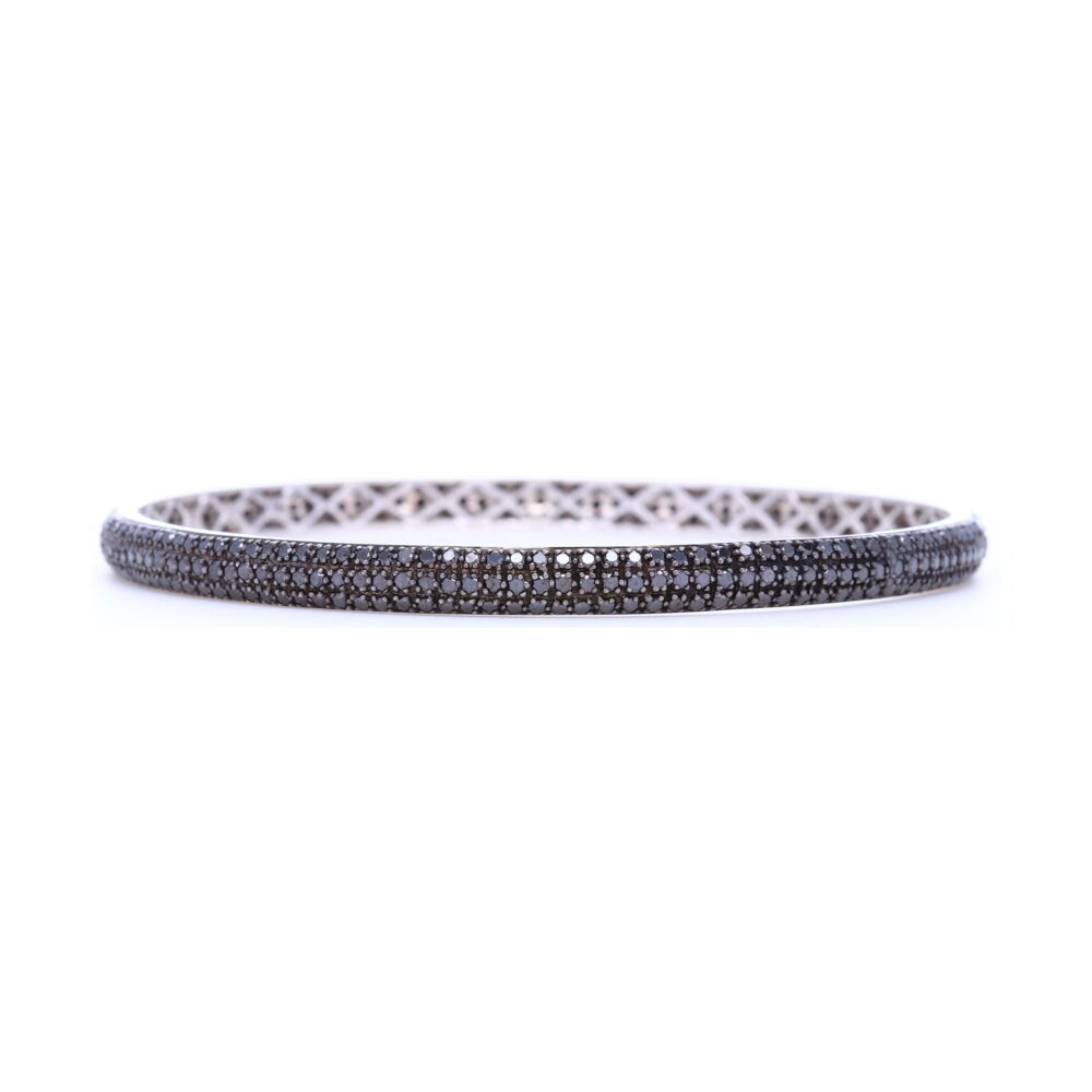 4.55ct black diamonds set in 18k white gold covered in black rhodium give this Tyre bangle an edgy look that provides load of contrast to any bangle stack. Tyre Bangle Bracelet with Black Diamonds set in 18k White Gold and Black Rhodium